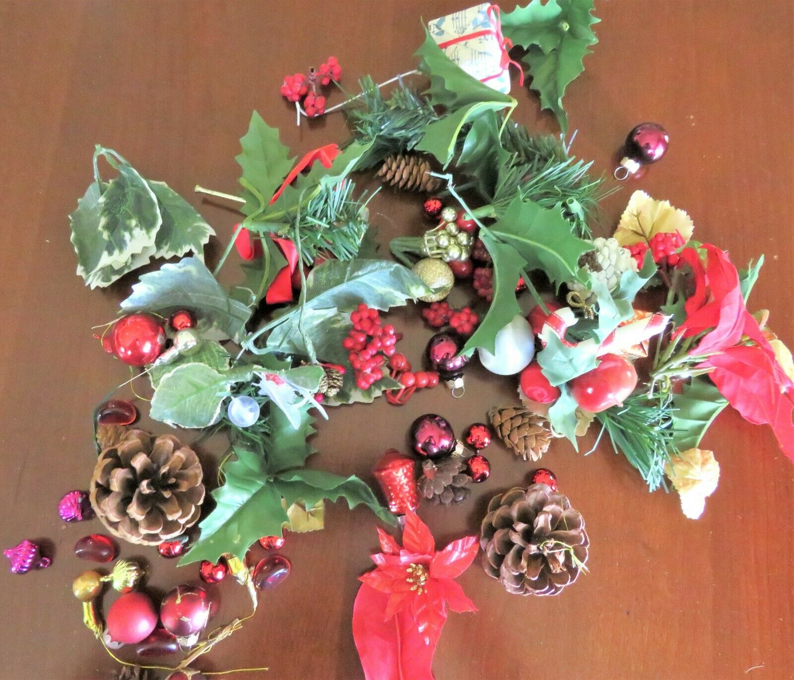 Mixed Christmas small silks, greens, mini ornaments, picks of poinsettia, pine